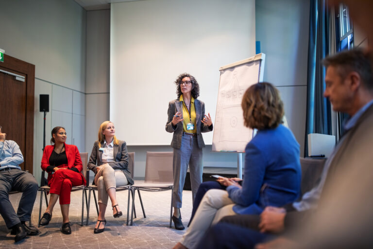 Businesswoman giving presentation during a seminar