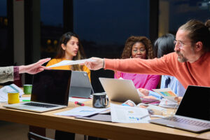 employees collaborating at table