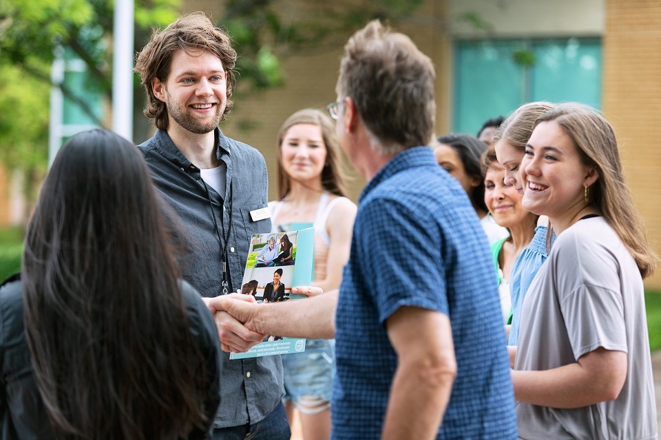 Employees meeting and shaking hands