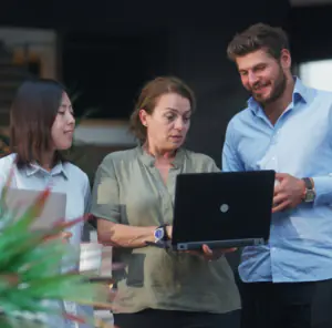 Discover what's new in Totara Version 20 - Image of workers using a laptop